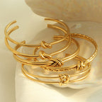 Pulseira Nodus com nó, banho dourado
