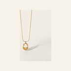 Colar Ovum VIATRIX – pendente oval dourado